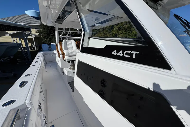 Slide: The Image of 2026 Caymas 44 CT boat with sleek design and modern seating. - 21