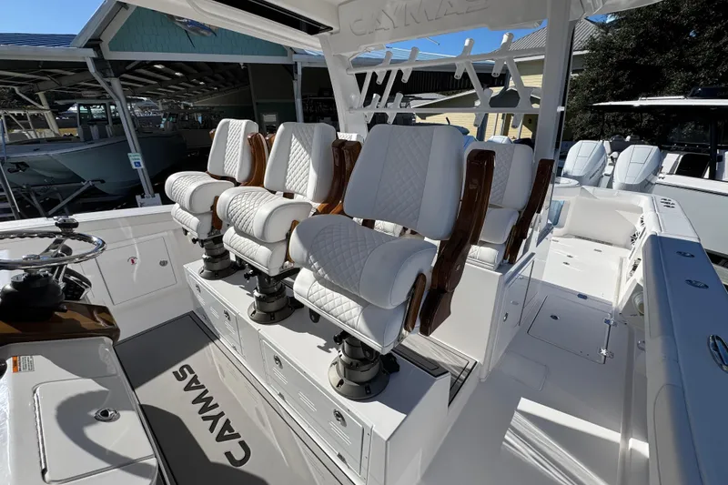 Slide: The Image of Luxury seating on 2026 Caymas 44 CT boat, featuring elegant white upholstery. - 26