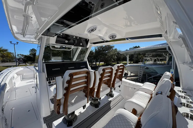 Slide: The Image of 2026 Caymas 44 CT boat interior with luxurious seating and advanced Garmin navigation system. - 34