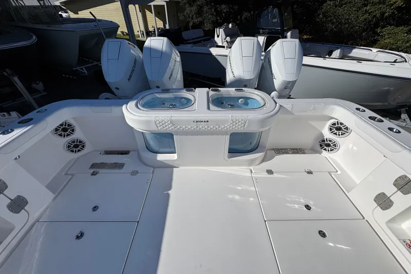 Slide: The Image of 2026 Caymas 44 CT boat deck with dual livewells and powerful Mercury engines. - 41