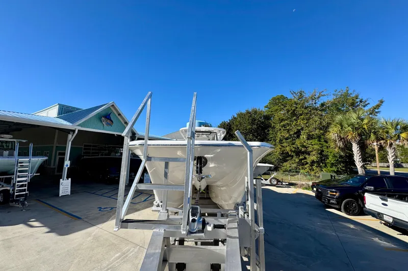 Slide: The Image of 2026 Caymas 44 CT boat on trailer under clear blue sky. - 5