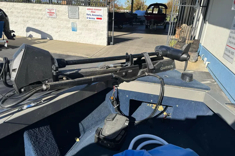 Slide: The Image of 2001 Lund 1700 Pro Sport boat with Garmin trolling motor in a service area. - 8