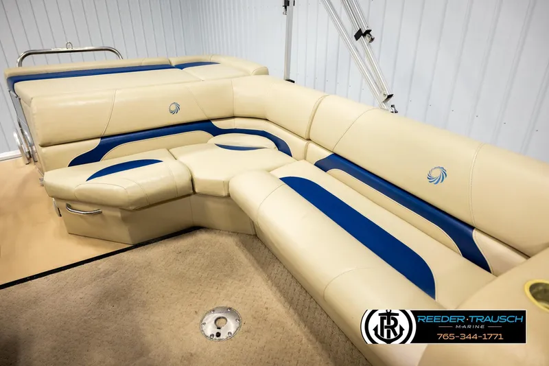 Slide: The Image of Luxurious beige and blue seating on a 2015 Lowe SS 210 boat. - 20