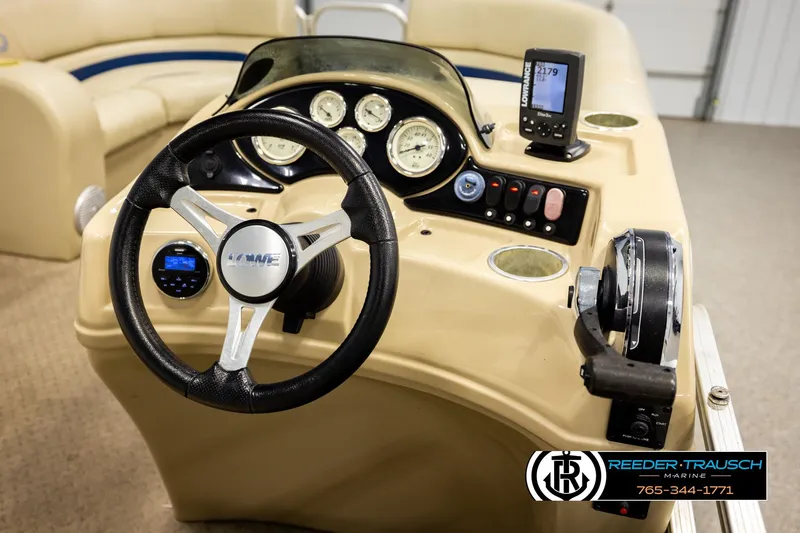 Slide: The Image of Steering console of 2015 Lowe SS 210 boat with gauges and controls. - 24