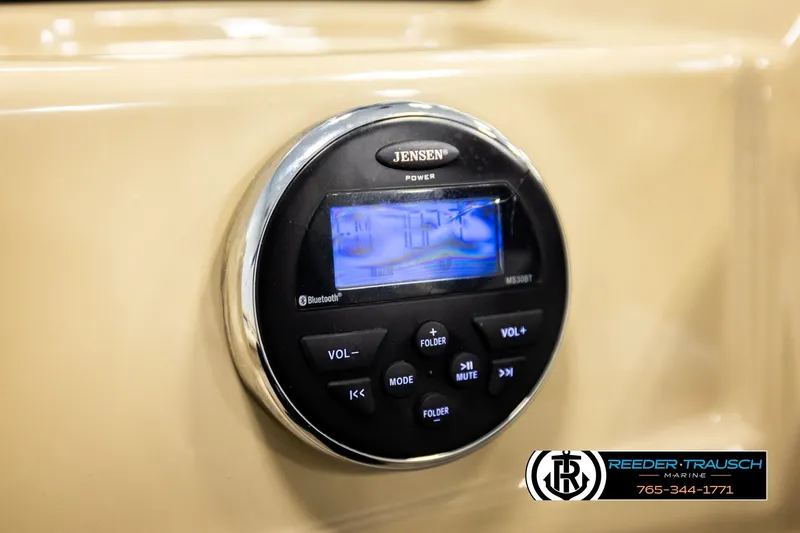 Slide: The Image of Jensen Bluetooth stereo system on 2015 Lowe SS 210 boat dashboard. - 27