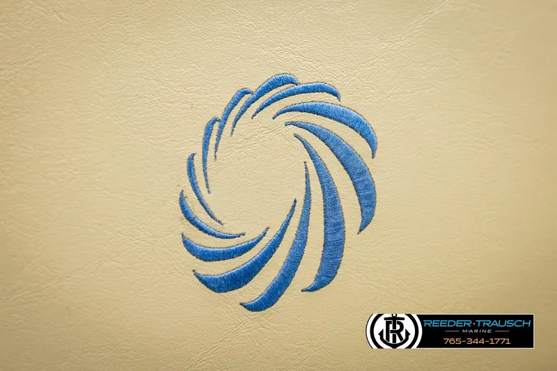 Slide: The Image of Blue swirl logo on beige leather, Lowe SS 210, 2015 model, Reeder-Trausch Marine branding. - 35