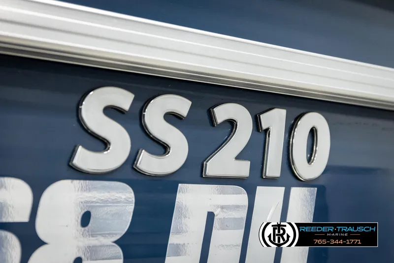Slide: The Image of 2015 Lowe SS 210 boat model emblem with Reeder-Trausch Marine logo. - 47