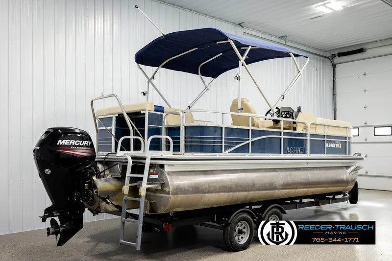 Slide: The Image of 2015 Lowe SS 210 pontoon boat with Mercury engine in indoor showroom. - 6