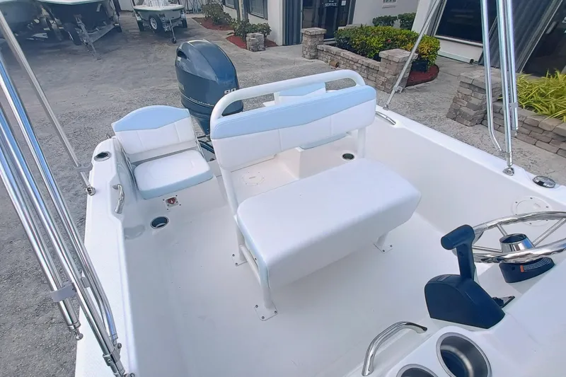 Slide: The Image of 2026 Robalo R160 Center Console boat interior with seating and steering wheel. - 11