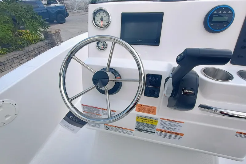 Slide: The Image of 2026 Robalo R160 Center Console dashboard with steering wheel and Yamaha controls. - 14