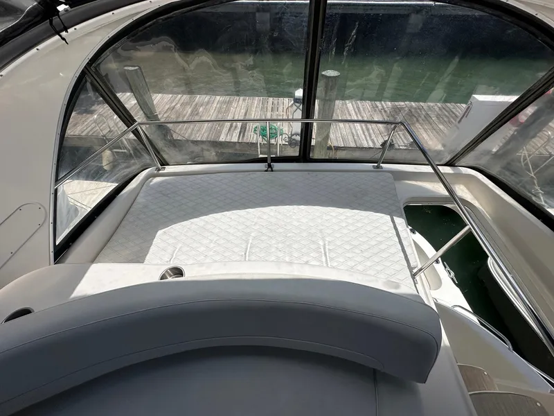 Slide: The Image of 2007 Meridian 411 Sedan yacht interior with spacious seating and large windows. - 10