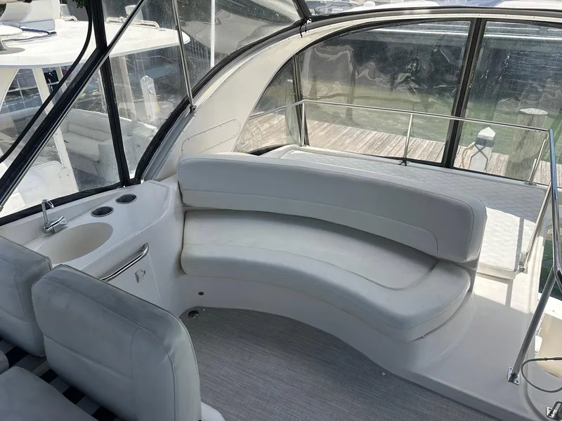 Slide: The Image of 2007 Meridian 411 Sedan interior with curved white seating and windows. - 11