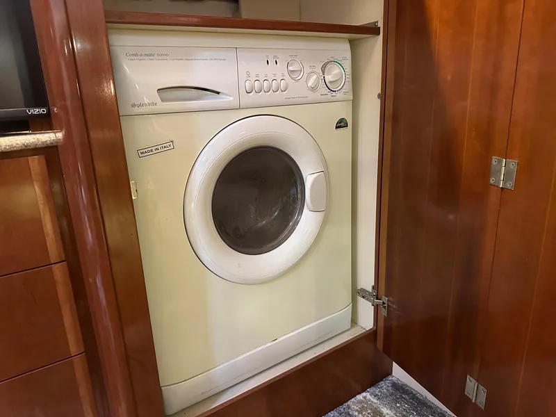 Slide: The Image of Washer in 2007 Meridian 411 Sedan yacht interior, wooden cabinetry. - 13