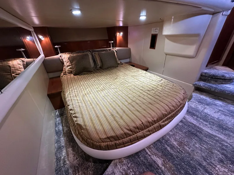 Slide: The Image of Luxurious bedroom interior of 2007 Meridian 411 Sedan yacht with cozy bedding. - 14