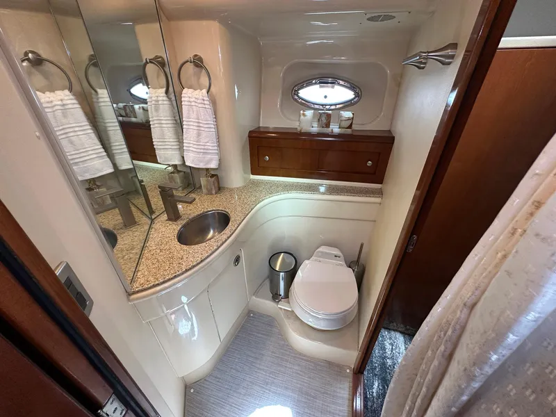 Slide: The Image of Luxurious bathroom in 2007 Meridian 411 Sedan yacht with modern fixtures and elegant design. - 16