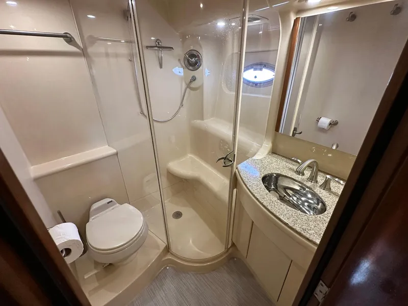 Slide: The Image of Luxurious bathroom in 2007 Meridian 411 Sedan yacht with shower, toilet, and sink. - 18