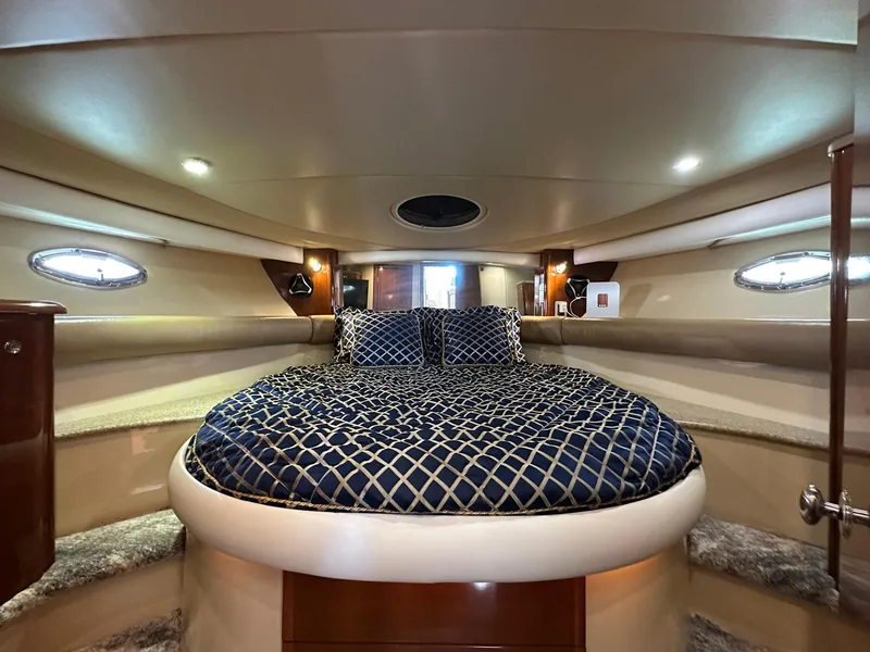 Slide: The Image of Luxurious interior of 2007 Meridian 411 Sedan yacht with elegant bedding and ambient lighting. - 19