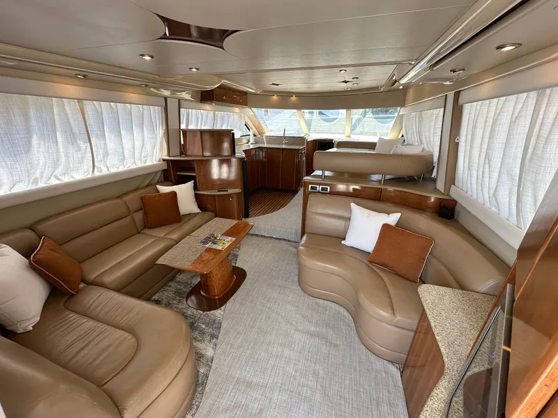 Slide: The Image of Luxurious interior of a 2007 Meridian 411 Sedan yacht with elegant leather seating. - 23
