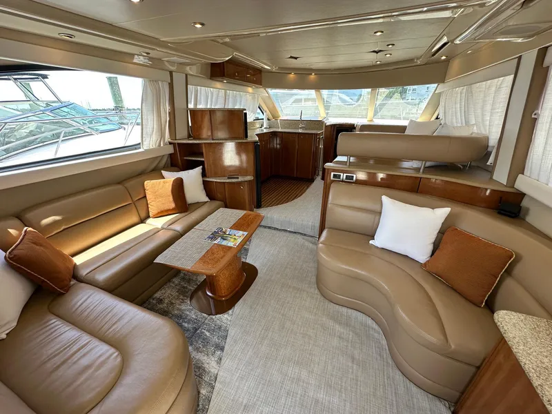 Slide: The Image of Luxurious interior of a 2007 Meridian 411 Sedan yacht with elegant seating and wood finishes. - 26