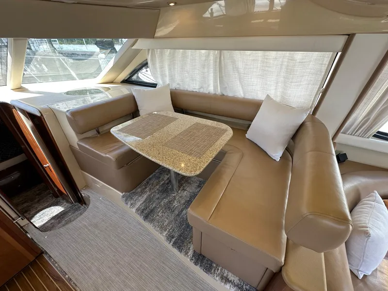Slide: The Image of Luxurious interior of a 2007 Meridian 411 Sedan yacht with leather seating and dining area. - 27