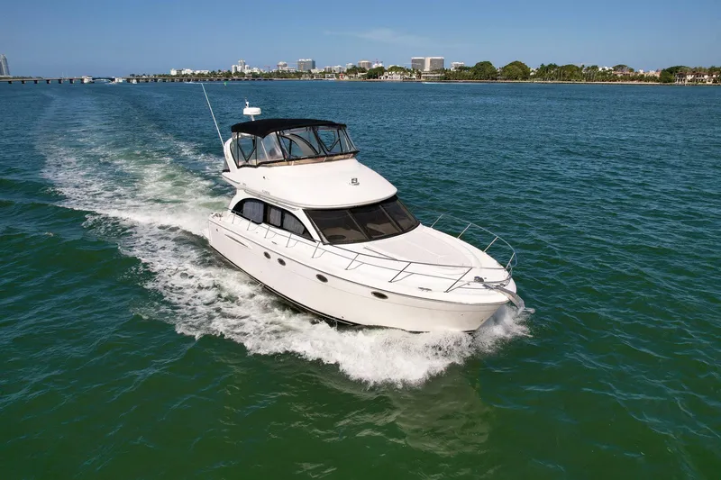 Slide: The Image of 2007 Meridian 411 Sedan cruising on open water under clear skies. - 3