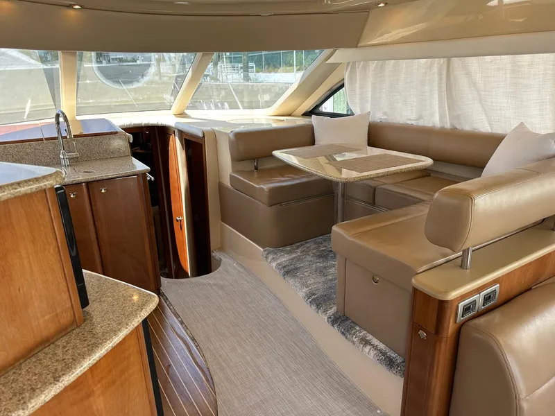 Slide: The Image of Luxurious interior of a 2007 Meridian 411 Sedan yacht with elegant seating and dining area. - 30