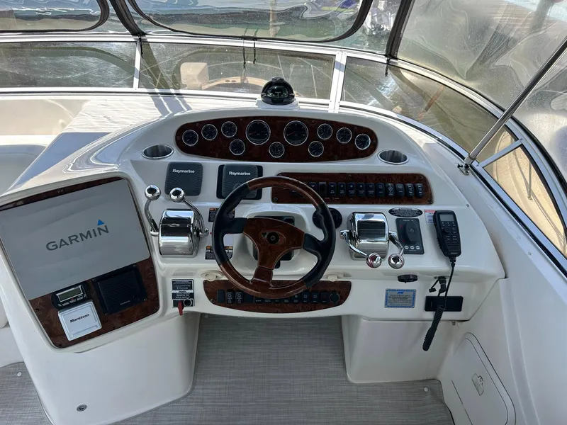 Slide: The Image of 2007 Meridian 411 Sedan helm with Garmin navigation and wood-accented steering wheel. - 33