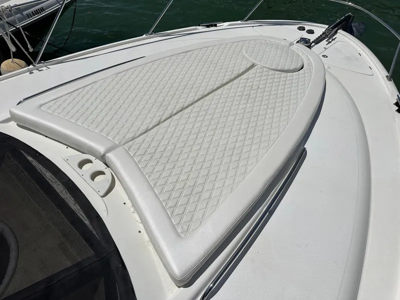 Slide: The Image of 2007 Meridian 411 Sedan boat with white cushioned deck, diamond pattern upholstery. - 36