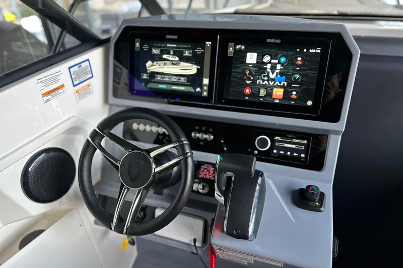Slide: The Image of Cockpit of 2025 Navan S-30 boat with advanced navigation displays and controls. - 12