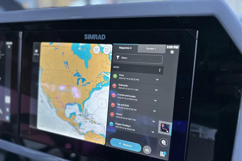Slide: The Image of Simrad navigation display in Navan S-30, 2025 model, showing map and waypoints. - 15