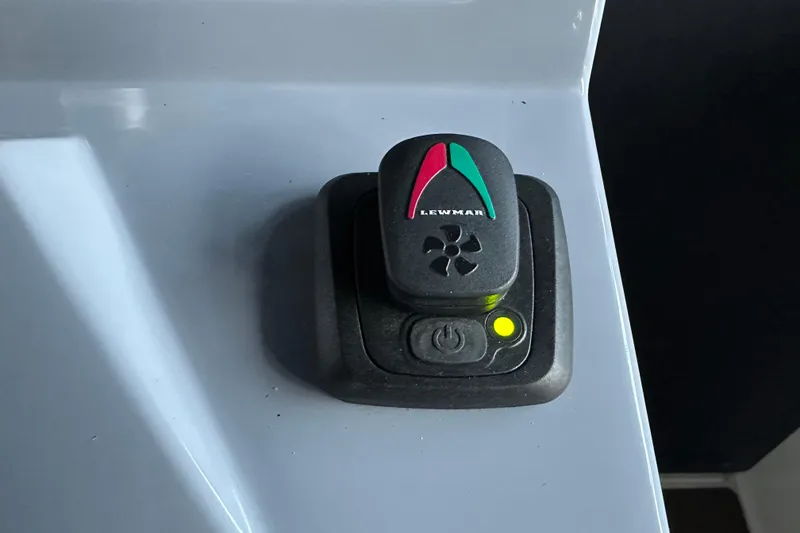 Slide: The Image of Lewmar control switch on Navan S-30, 2025 model, with power button and indicator light. - 20