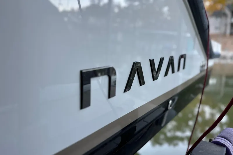 Slide: The Image of Close-up of 2025 Navan S-30 boat logo on sleek white surface. - 27