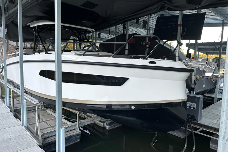 Slide: The Image of 2025 Navan S-30 boat docked in a covered marina. - 3