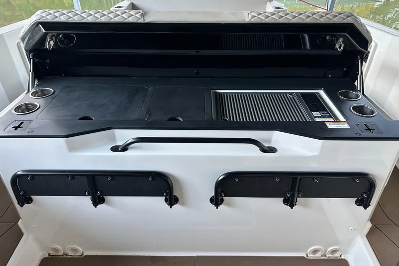 Slide: The Image of Navan S-30 2025 boat interior with grill and cup holders on deck. - 32
