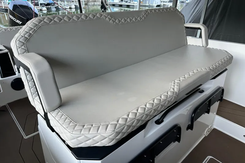 Slide: The Image of Luxurious seating on 2025 Navan S-30 boat with quilted upholstery and armrests. - 34