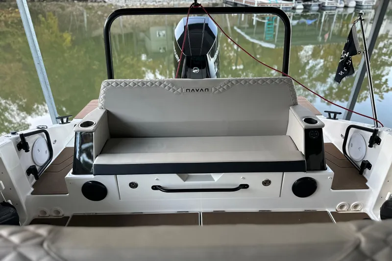 Slide: The Image of 2025 Navan S-30 boat interior with cushioned seating and modern design. - 8