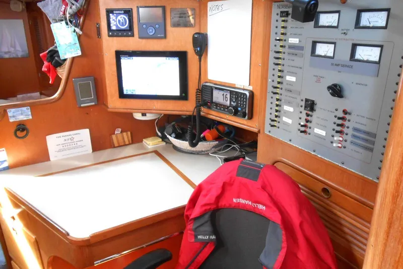 Slide: The Image of Navigation station of 1989 Norseman 447 yacht with control panel and equipment. - 17