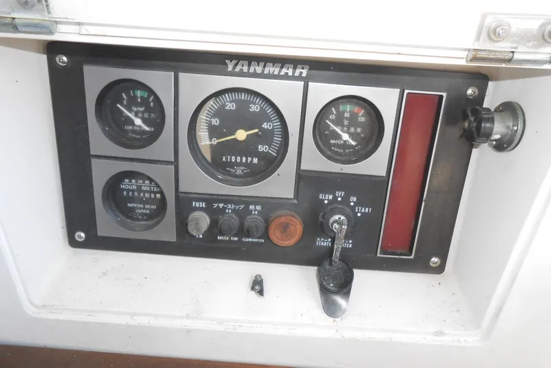 Slide: The Image of Control panel of a 1989 Norseman 447 boat with Yanmar engine gauges. - 23