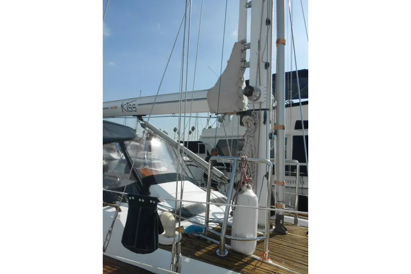 Slide: The Image of Sailboat deck view of 1989 Norseman 447, featuring rigging and equipment. - 25