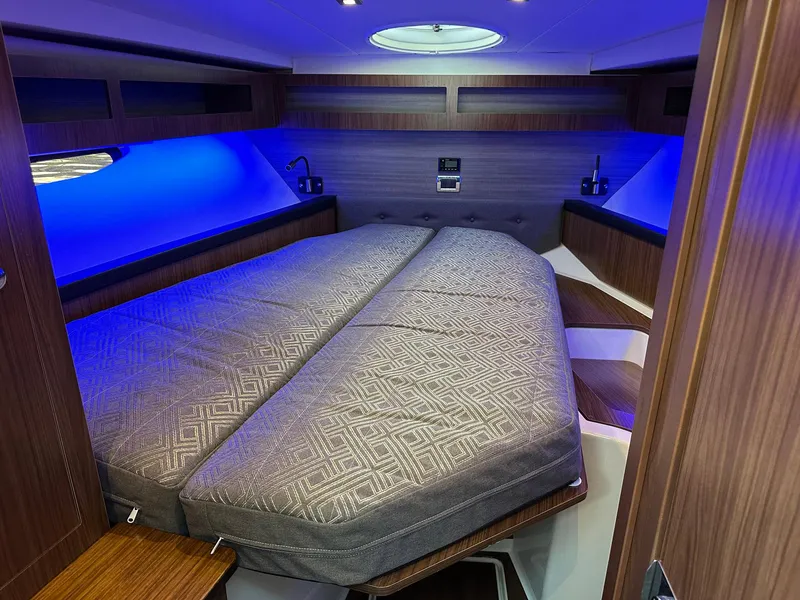 Slide: The Image of Luxurious interior cabin of 2020 Four Winns Vista 355 Coupe with ambient lighting. - 15