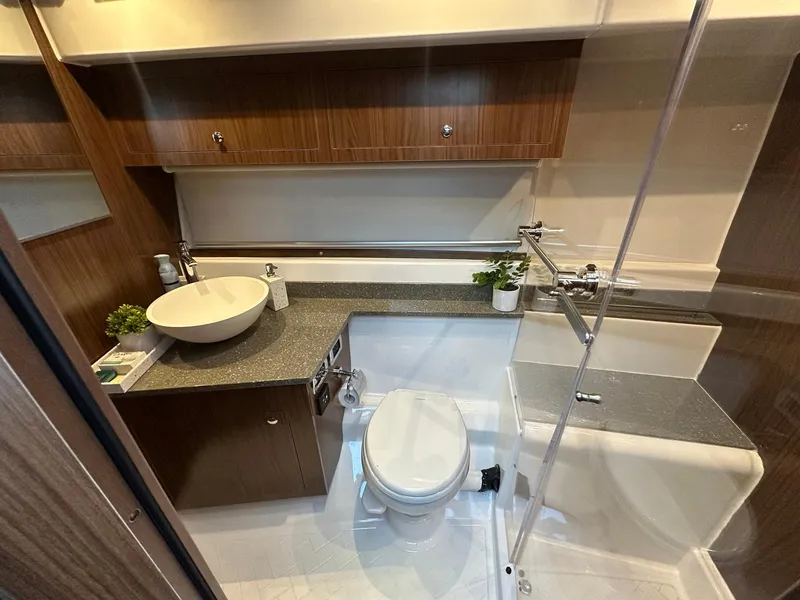 Slide: The Image of Modern bathroom in 2020 Four Winns Vista 355 Coupe yacht with sleek design and amenities. - 18