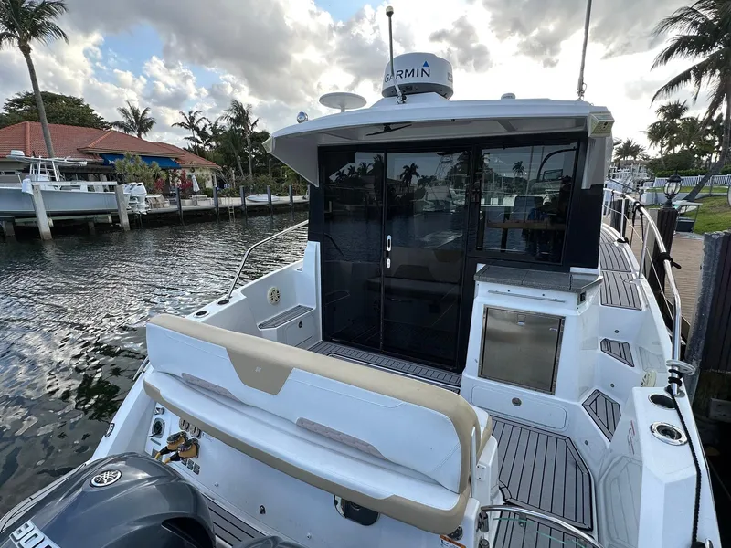 Slide: The Image of 2020 Four Winns Vista 355 Coupe docked, showcasing sleek design and modern features. - 7