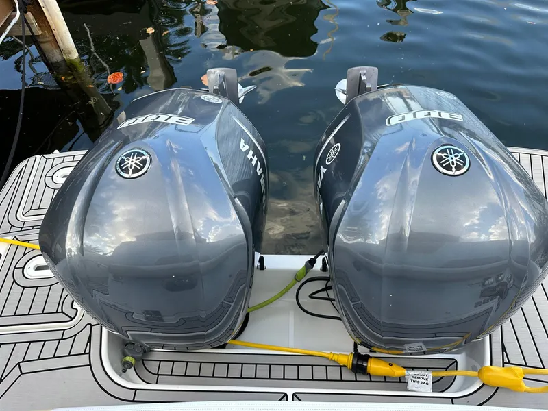Slide: The Image of Twin Yamaha outboard engines on a 2020 Four Winns Vista 355 Coupe boat. - 9