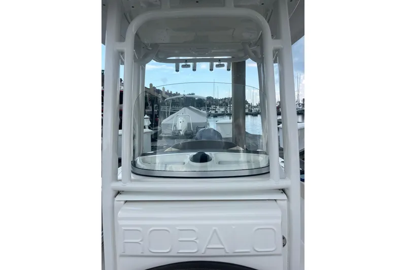 Slide: The Image of 2021 Robolo 242EX boat console with marina background. - 14