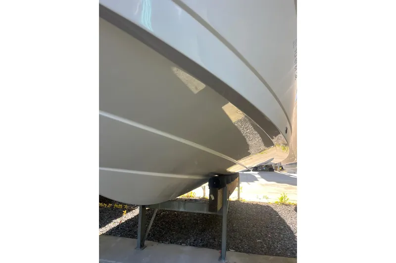 Slide: The Image of 2021 Robolo 242EX boat hull on a stand, showcasing sleek design and craftsmanship. - 15