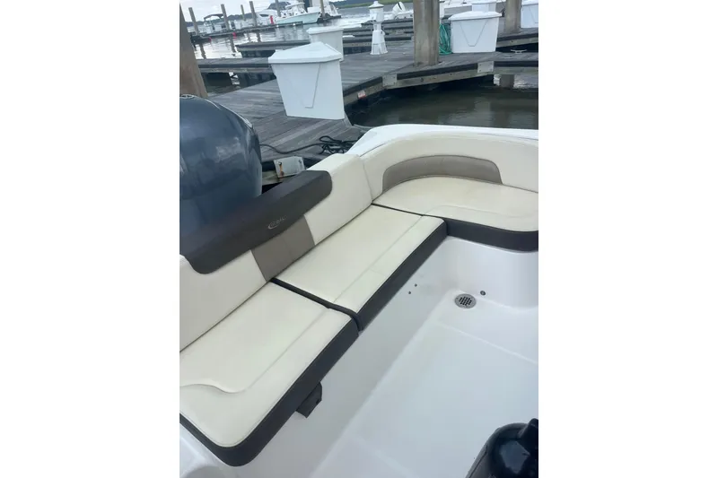 Slide: The Image of Robolo 242EX 2021 boat with beige seating at a marina dock. - 7