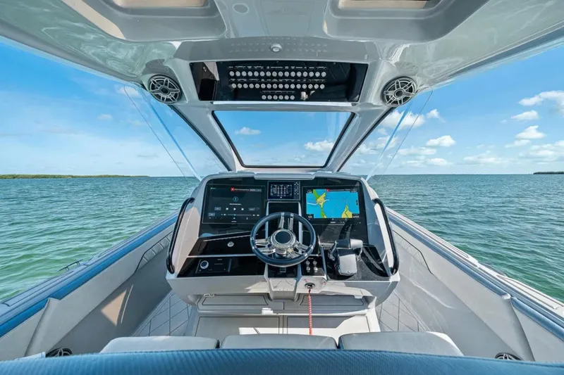 Slide: The Image of Cockpit of 2025 Deep Impact 369 Sport boat with advanced navigation systems. - 27
