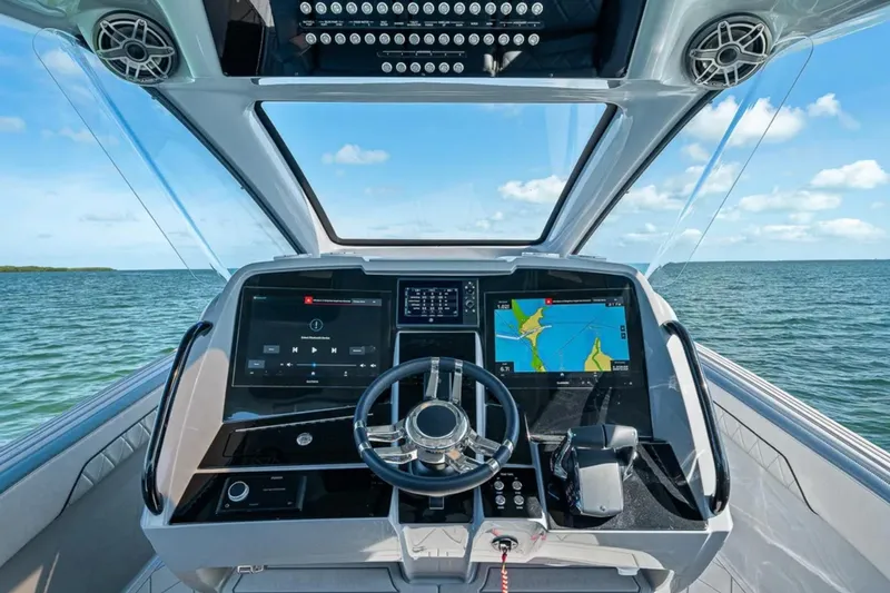 Slide: The Image of Cockpit view of 2025 Deep Impact 369 Sport boat with advanced navigation system. - 28