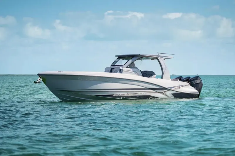 Slide: The Image of 2025 Deep Impact 369 Sport boat on calm ocean waters under clear sky. - 3