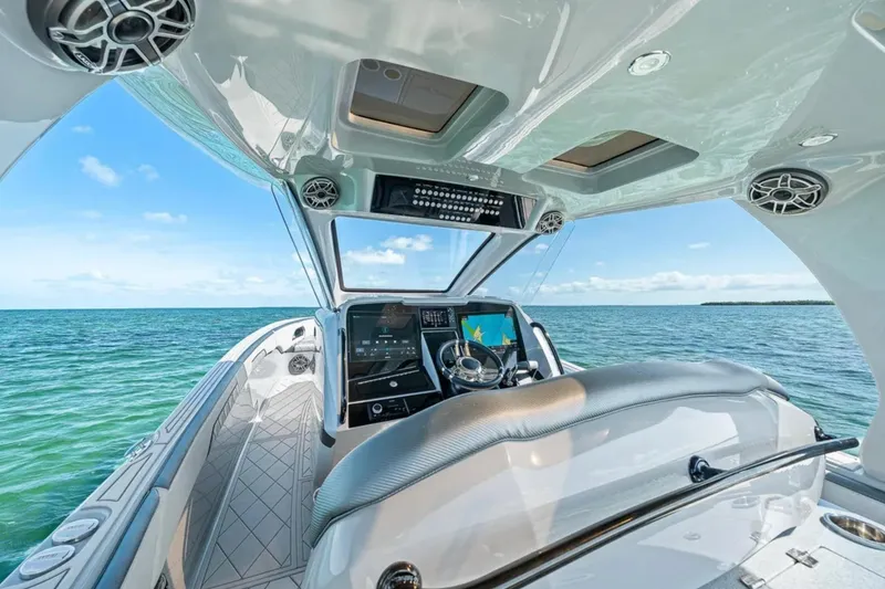 Slide: The Image of Interior view of 2025 Deep Impact 369 Sport boat with ocean backdrop. - 34